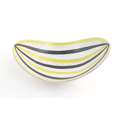 196 - A Swedish mid century studio pottery bowl of shaped form by Stig Lindberg for Gustavsberg. Marked un... 