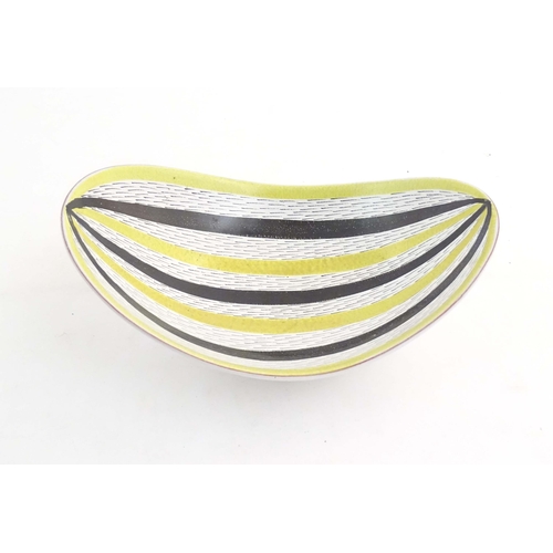 196 - A Swedish mid century studio pottery bowl of shaped form by Stig Lindberg for Gustavsberg. Marked un... 