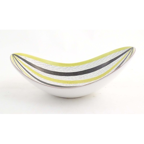 196 - A Swedish mid century studio pottery bowl of shaped form by Stig Lindberg for Gustavsberg. Marked un... 