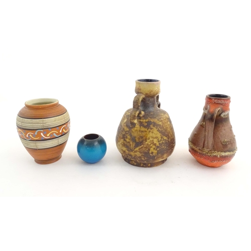 199 - Four West German vases to include a vase with banded decoration, a twin handled vase, a single handl... 