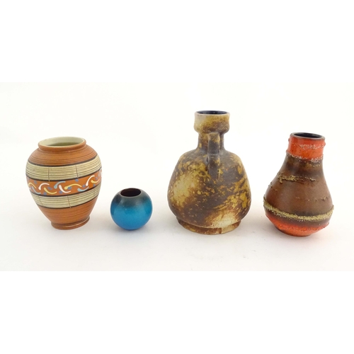 199 - Four West German vases to include a vase with banded decoration, a twin handled vase, a single handl... 