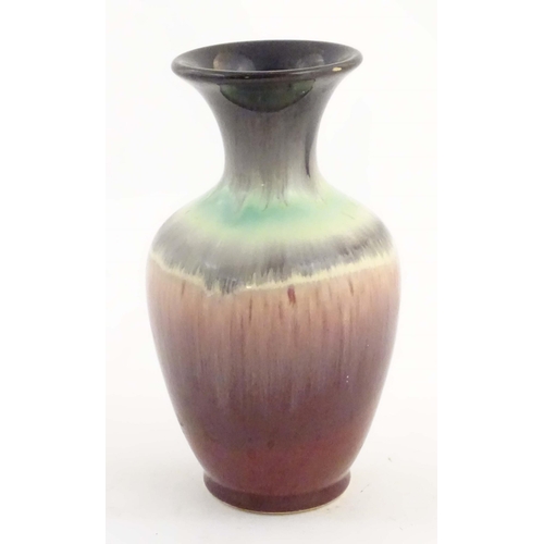 202 - A West German vase with a drip glaze, numbered 2093 under. Approx. 6