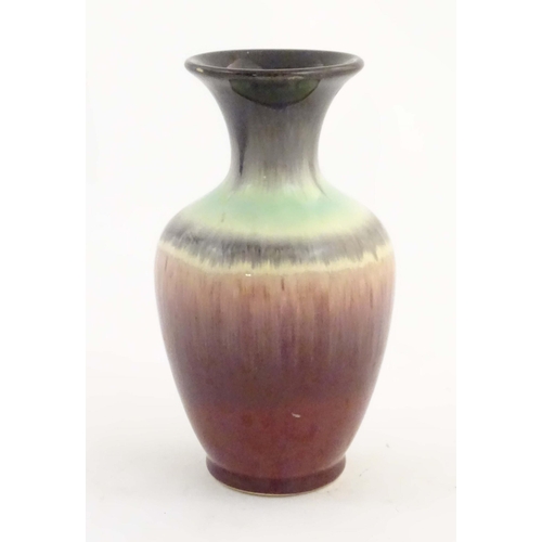 202 - A West German vase with a drip glaze, numbered 2093 under. Approx. 6