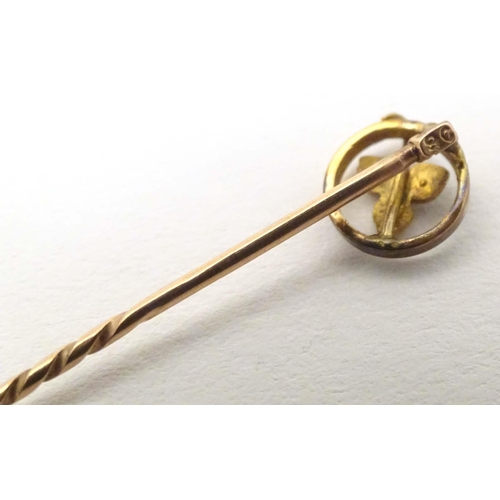 632 - A 9ct gold stick pin with seed pearl. Approx 2 1/4