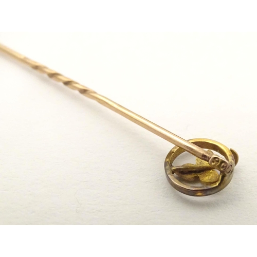 632 - A 9ct gold stick pin with seed pearl. Approx 2 1/4