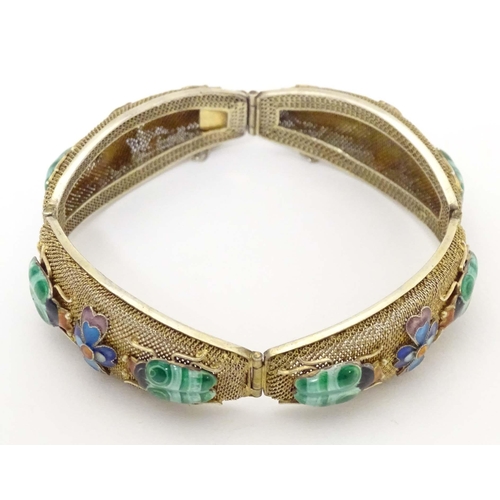 636 - An Oriental silver gilt bracelet with enamel floral and insect beetle decoration