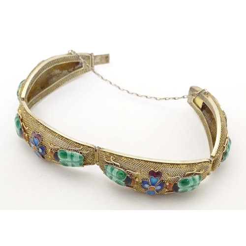 636 - An Oriental silver gilt bracelet with enamel floral and insect beetle decoration