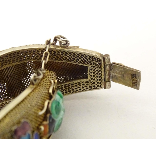 636 - An Oriental silver gilt bracelet with enamel floral and insect beetle decoration