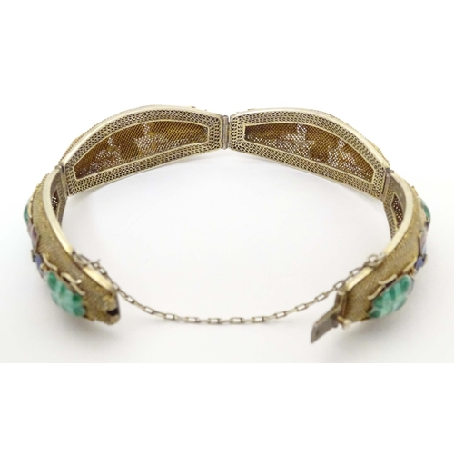 636 - An Oriental silver gilt bracelet with enamel floral and insect beetle decoration