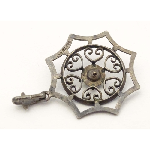 637 - Scandinavian silver : A silver pendant with enamel decoration. marked 935 Silver. Approx 1