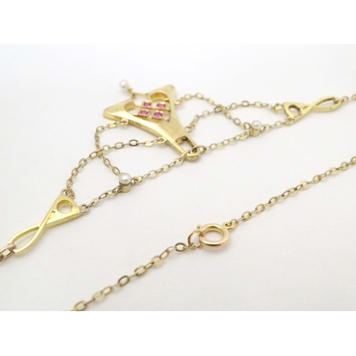 641 - A 14ct gold necklace, the pendant section set with pearls and red stones. The whole approx 19