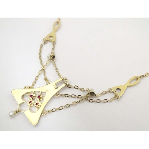 641 - A 14ct gold necklace, the pendant section set with pearls and red stones. The whole approx 19