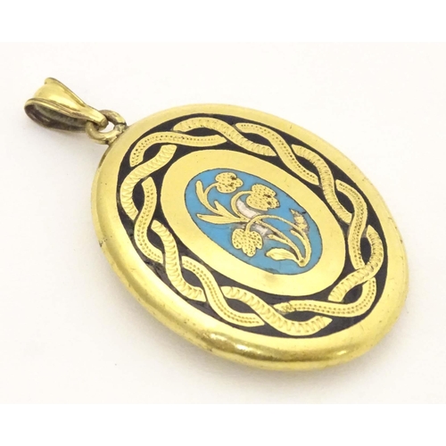 645 - Mourning / memorial jewellery : A yellow metal locket of pendant form with forget-me-not blue and bl... 