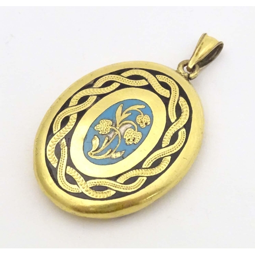 645 - Mourning / memorial jewellery : A yellow metal locket of pendant form with forget-me-not blue and bl... 