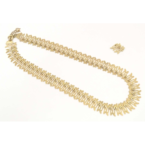 648 - A 9ct gold necklace with textured detail. Hallmarked Birmingham  1975 maker J A Main Ltd. Approx 15 ... 