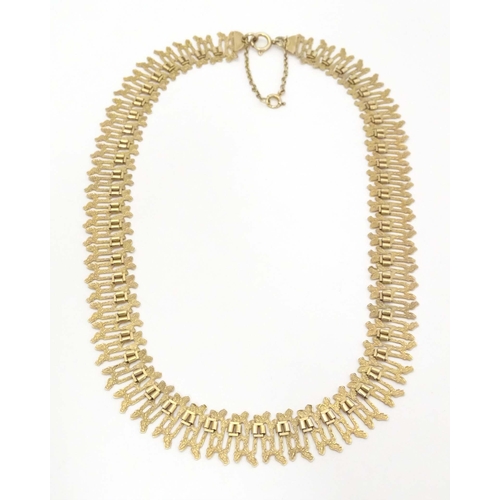 648 - A 9ct gold necklace with textured detail. Hallmarked Birmingham  1975 maker J A Main Ltd. Approx 15 ... 