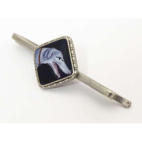 649 - A white metal tie clip with enamel dog head detail to centre. 1 3/4