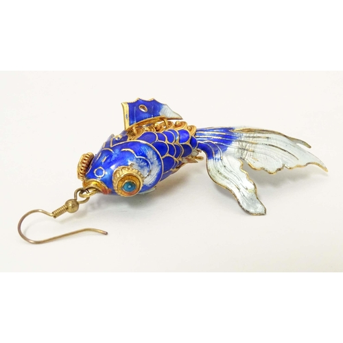 656 - A pair of drop earrings set with enamel and gilt decorated articulated fish. Approx. 3 3/4