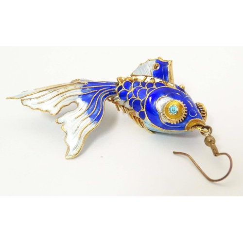 656 - A pair of drop earrings set with enamel and gilt decorated articulated fish. Approx. 3 3/4