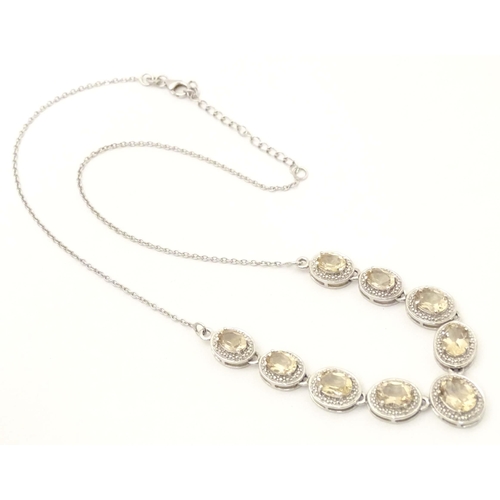 660 - A silver necklace set with 9 facet cut Bolivarian quartz. Approx. 16