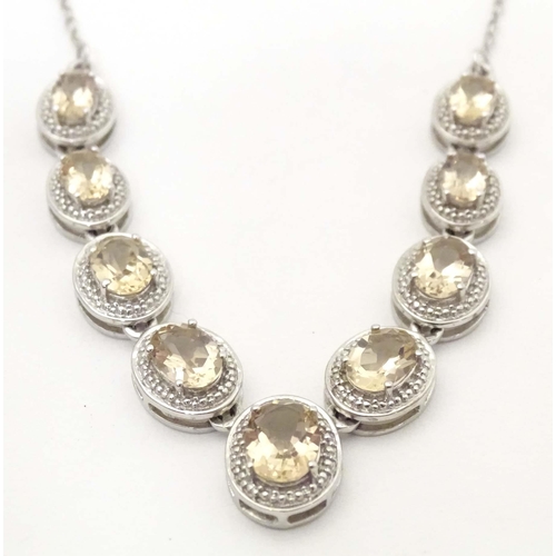 660 - A silver necklace set with 9 facet cut Bolivarian quartz. Approx. 16