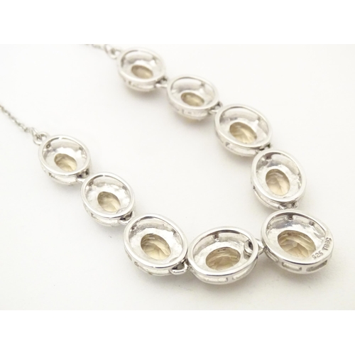 660 - A silver necklace set with 9 facet cut Bolivarian quartz. Approx. 16