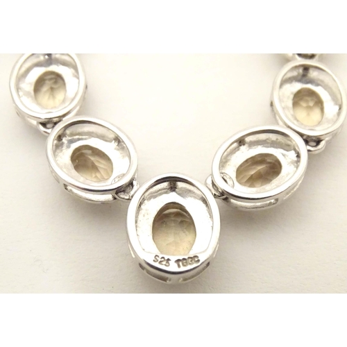 660 - A silver necklace set with 9 facet cut Bolivarian quartz. Approx. 16