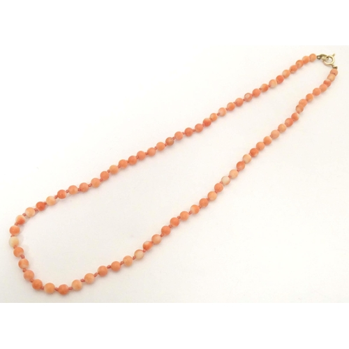 661 - An early 20thC coral bead necklace. Approx. 16