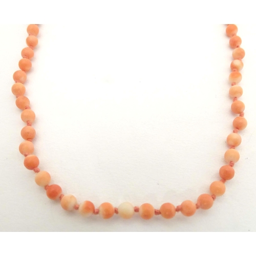 661 - An early 20thC coral bead necklace. Approx. 16