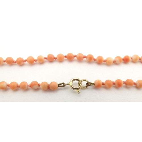 661 - An early 20thC coral bead necklace. Approx. 16