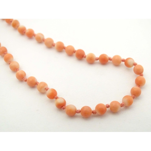 661 - An early 20thC coral bead necklace. Approx. 16