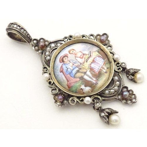 679 - A white metal pendant locket set with seed pearls and having hand painted enamel decoration to centr... 