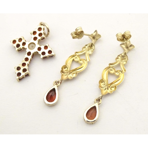 681 - A 9ct gold pendant of cross shape set with garnets and pearl to centre. Together with a pair of 9ct ... 