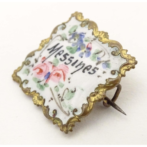 682 - A gilt metal brooch of square form with enamel floral decoration and titled Messines. Approx. 1