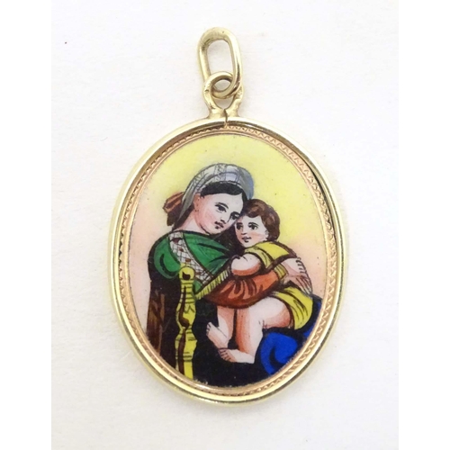 694 - A Continental gold pendant with enamel decoration depicting Madonna and Child with Hungarian script ... 