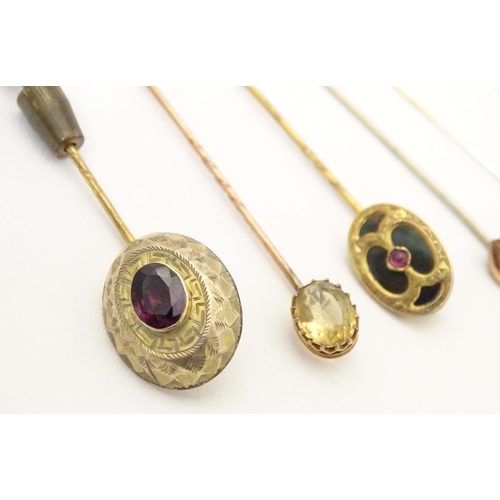 699 - Five assorted 19thC and later stick pins to include one set with bloodstone and central garnet, anot... 