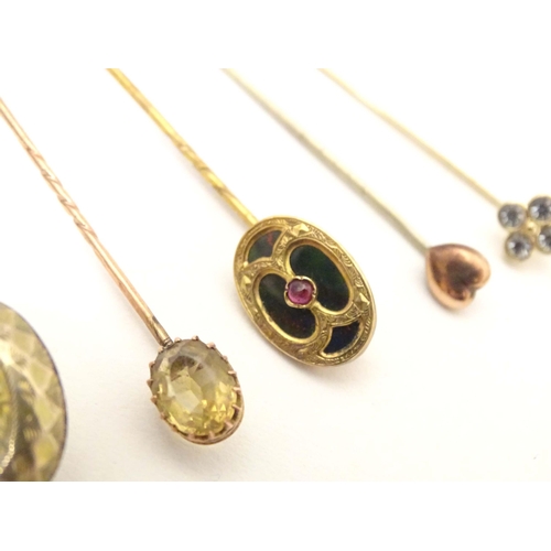 699 - Five assorted 19thC and later stick pins to include one set with bloodstone and central garnet, anot... 