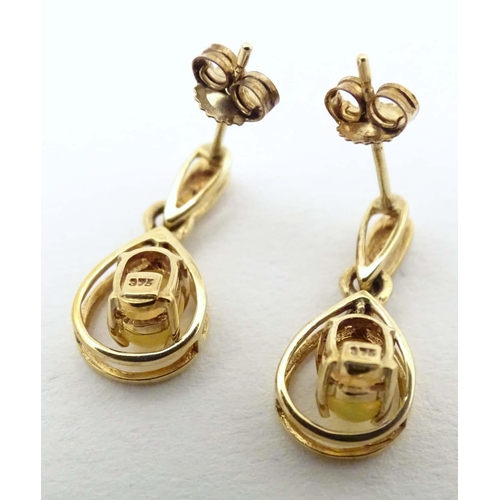 701 - 9ct gold drop earrings, to include one pair set with cabochon and chip set diamond, the other with f... 