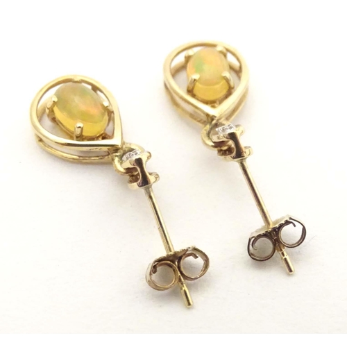 701 - 9ct gold drop earrings, to include one pair set with cabochon and chip set diamond, the other with f... 