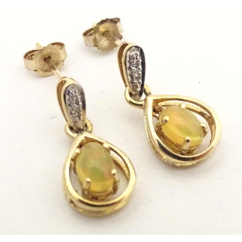 701 - 9ct gold drop earrings, to include one pair set with cabochon and chip set diamond, the other with f... 