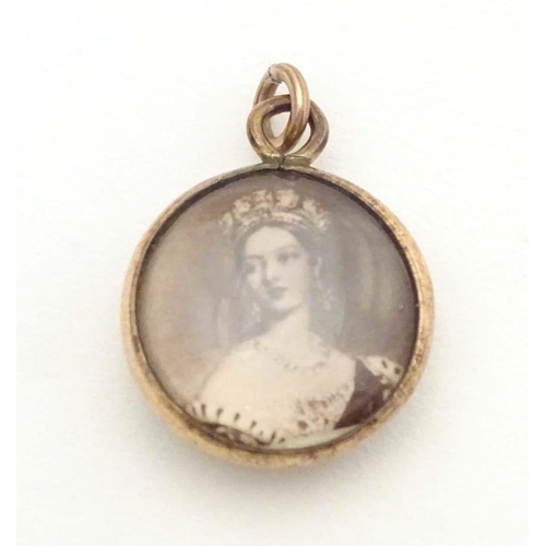 703 - A Victorian double sided pendant set with images of Queen Victoria. Approx. 3/4