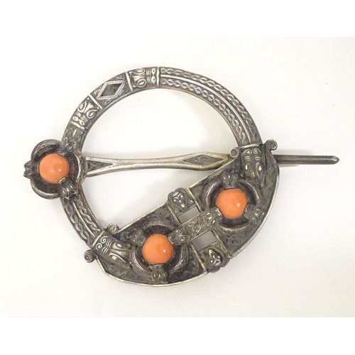 704A - A Victorian Irish / Celtic white metal tara brooch set with three coral cabochon. Marked West & Son,... 