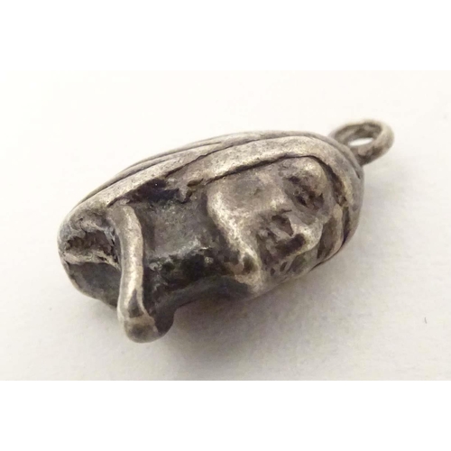 705 - A white metal pendant charm formed as the head of a Native American Indian. Approx. 1/2