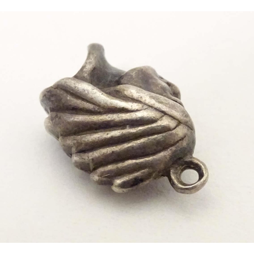 705 - A white metal pendant charm formed as the head of a Native American Indian. Approx. 1/2