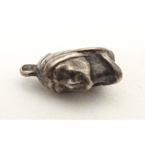 705 - A white metal pendant charm formed as the head of a Native American Indian. Approx. 1/2