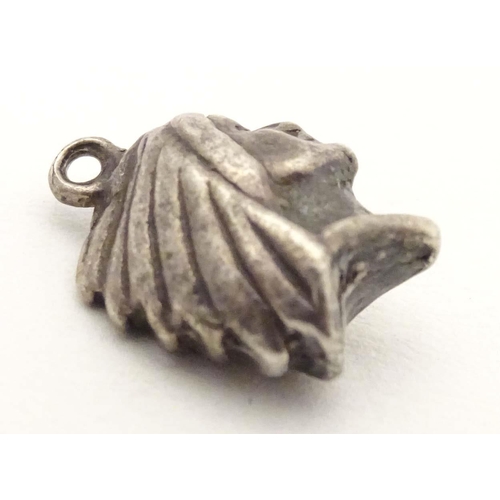 705 - A white metal pendant charm formed as the head of a Native American Indian. Approx. 1/2