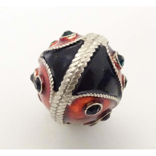 706 - A white metal pendant charm of egg form with stylised ladybird / ladybug detail with enamel detail. ... 