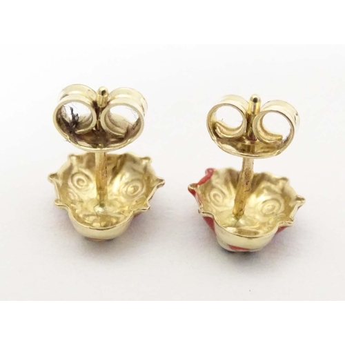 707 - A pair of 14ct gold stud earrings formed as ladybirds / ladybugs with enamel decoration. Approx. 1/4... 