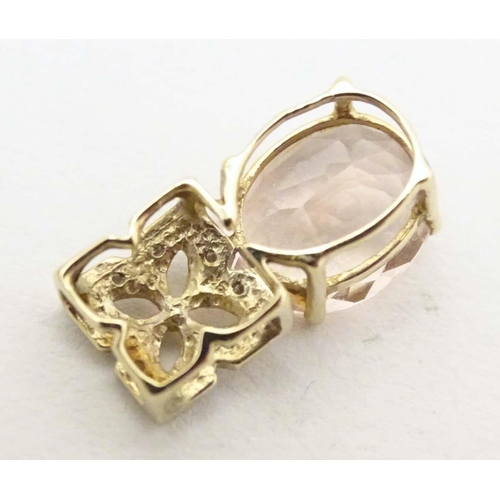 708 - A 9ct gold pendant set with morganite stone and chip set diamonds. Together with a pair of 9ct gold ... 