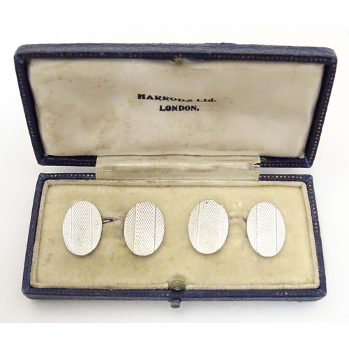 712 - Silver cufflinks with engine turned decoration. Cased.